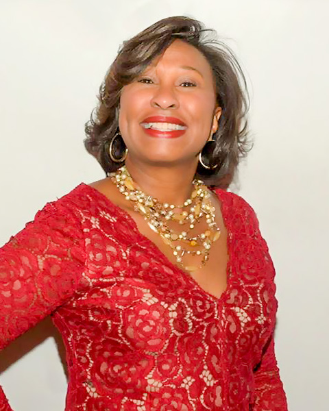 Sheila D. McKoy in a red evening dress